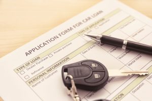 Car loan application form and keys