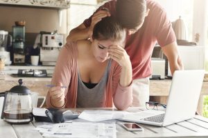 Unhappy couple stressed about paperwork