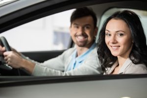 Man and woman driving in car