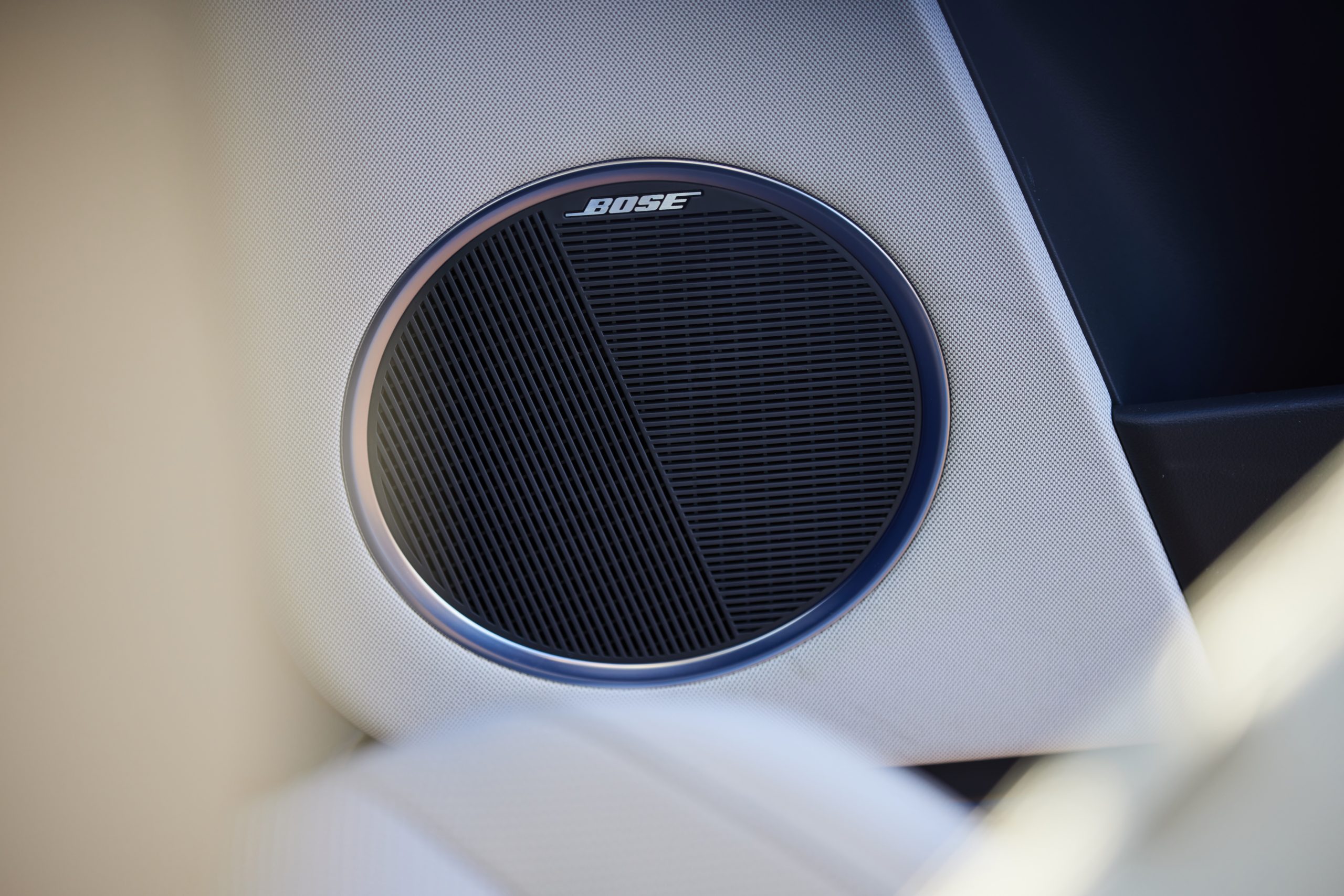 Hyundai IONIQ 5 close up of Bose speaker on an off-white interior background