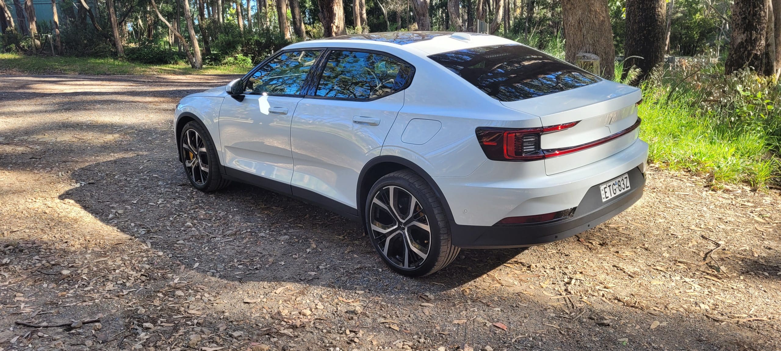 Snow coloured Polestar 2 dual motor EV with performance pack rear angle view