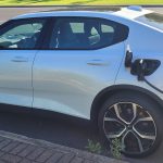 Polestar 2 dual motor EV with on street charger plugged in