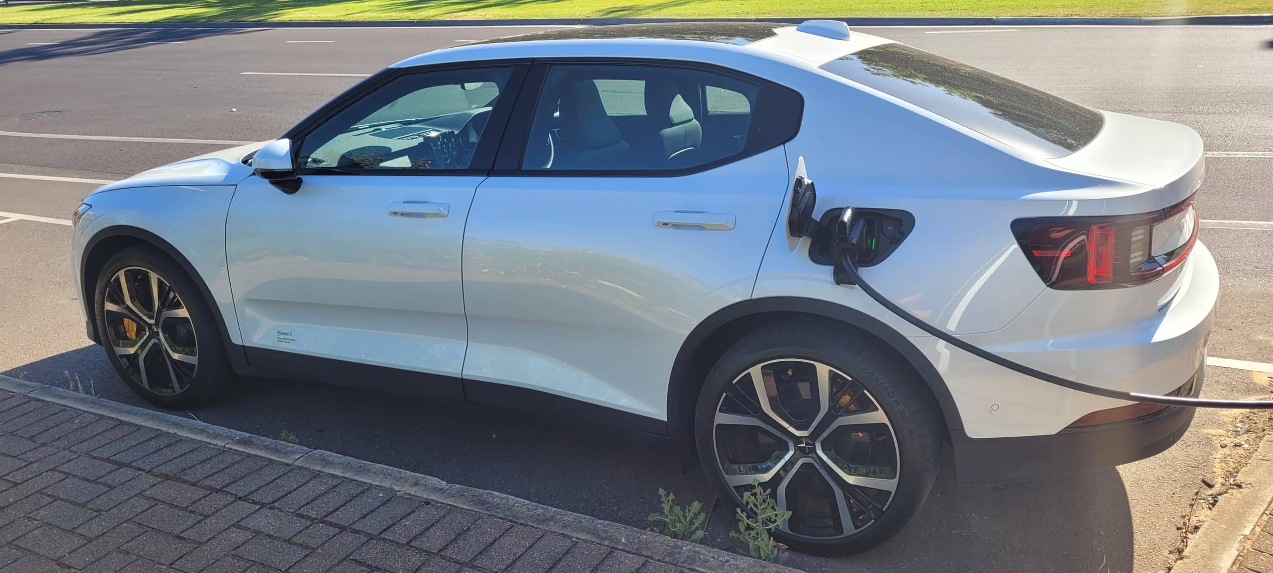 Polestar 2 dual motor EV with on street charger plugged in