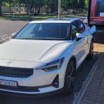 Snow coloured Polestar 2 dual motor EV with performance pack plugged into Jolt charging station