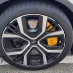 Polestar 2 20 inch rim close up of tyre and gold Brembo brakes