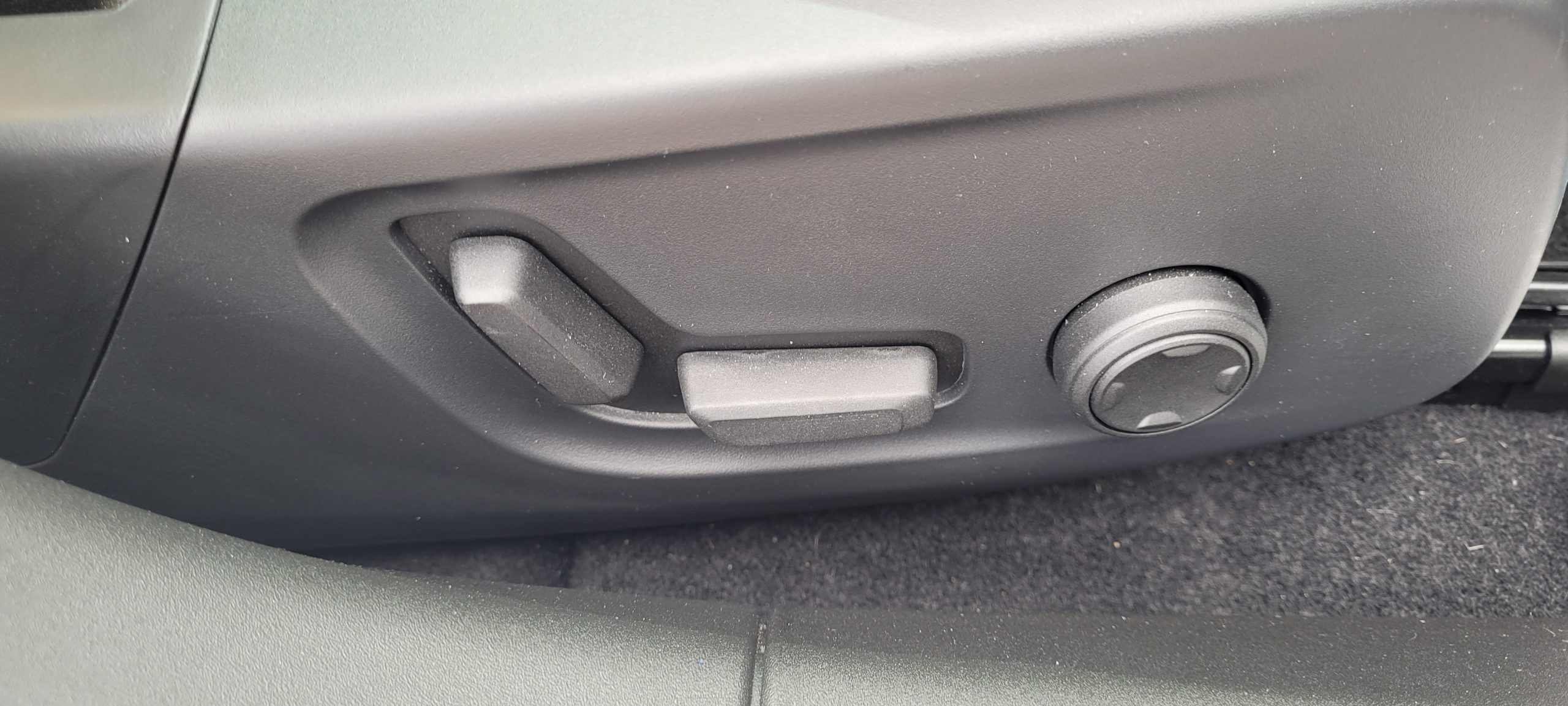 17) Front seat electronic adjustment controls in Polestar 2