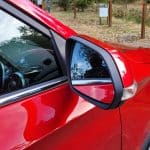 Red MG ZS EV driver side mirror