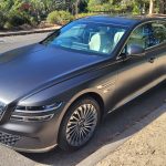 Makalu Matte Gray Genesis G80 electric front angle view on street