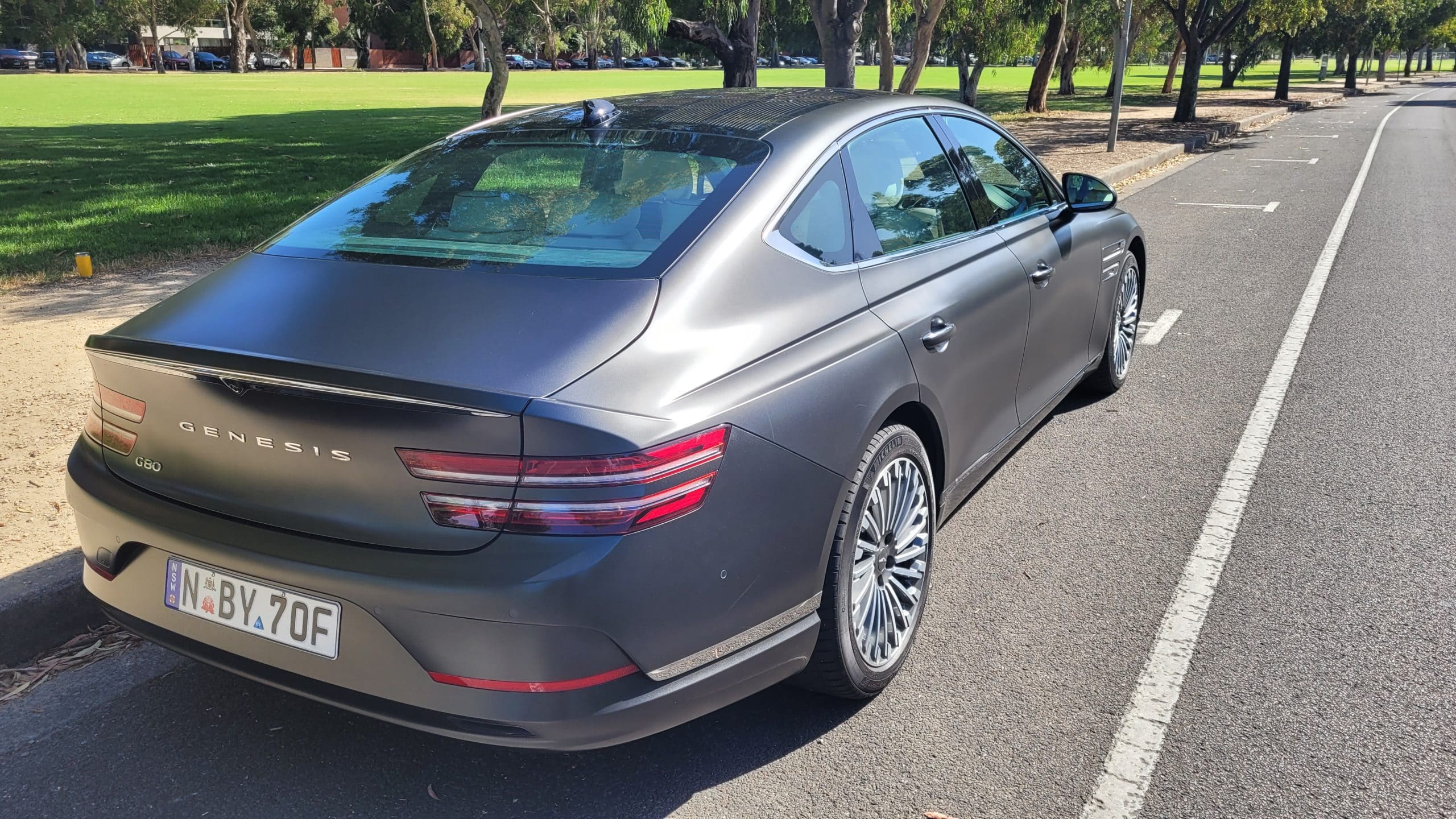 Makalu Matte Gray Genesis G80 electric rear quarter panel view