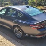 Makalu Matte Gray Genesis G80 electric rear left quarter panel view