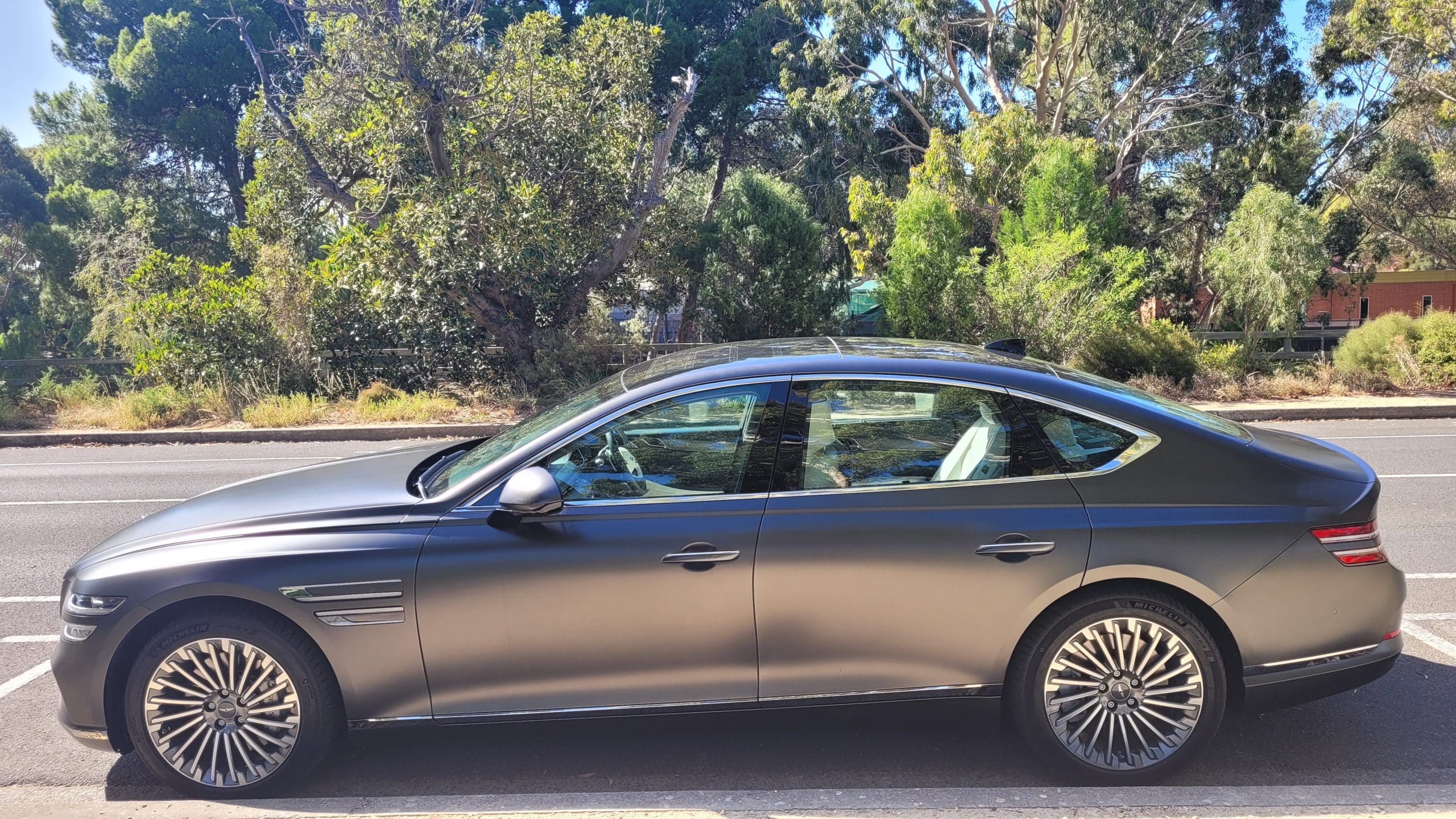 Makalu Matte Gray Genesis G80 electric vehicle left side profile