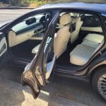 Makalu Matte Gray Genesis G80 electric vehicle with passenger doors open