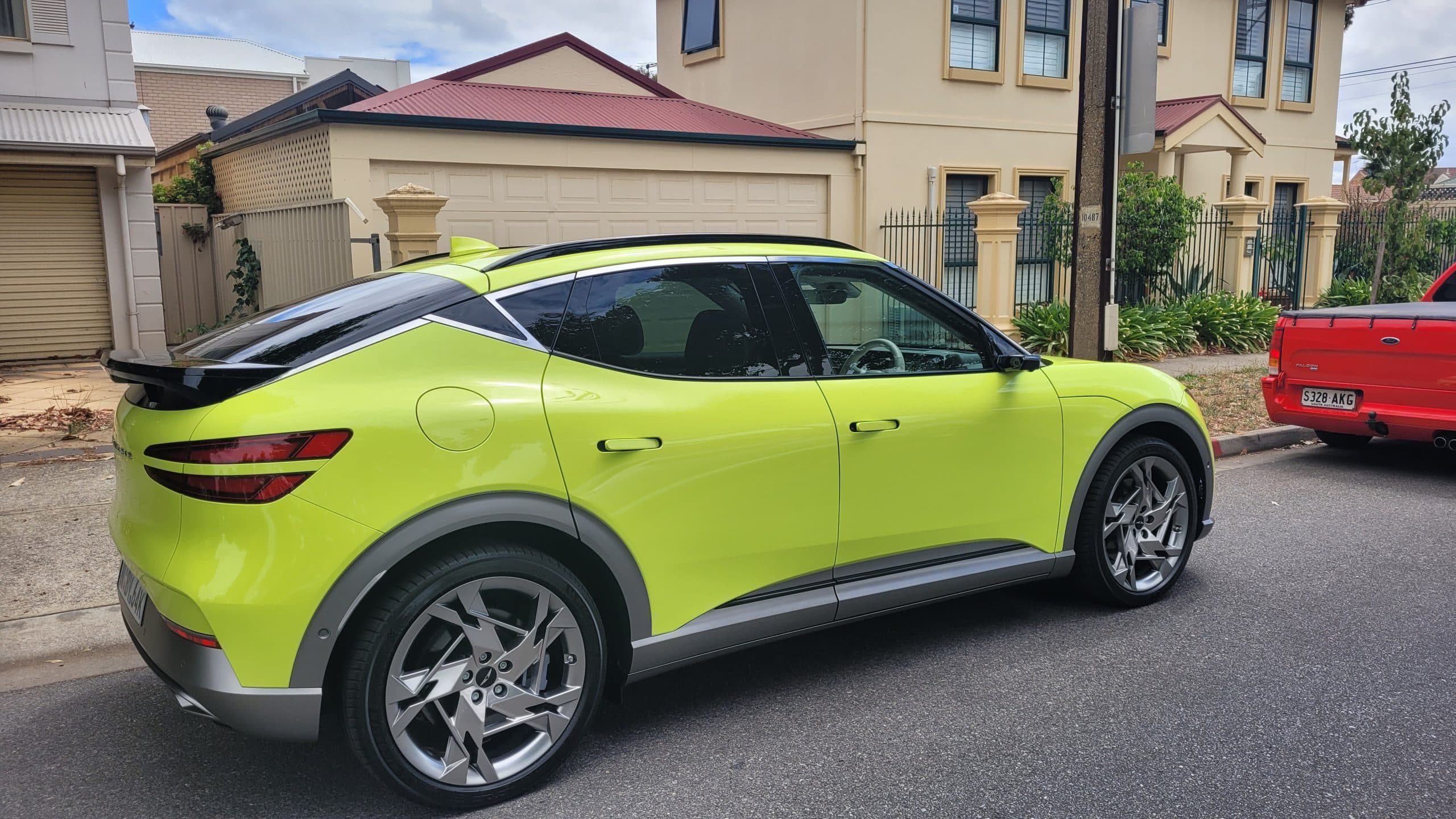 Sao Paulo Lime green Genesis GV60 right hand side view from back