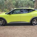 Genesis GV60 lime green profile view