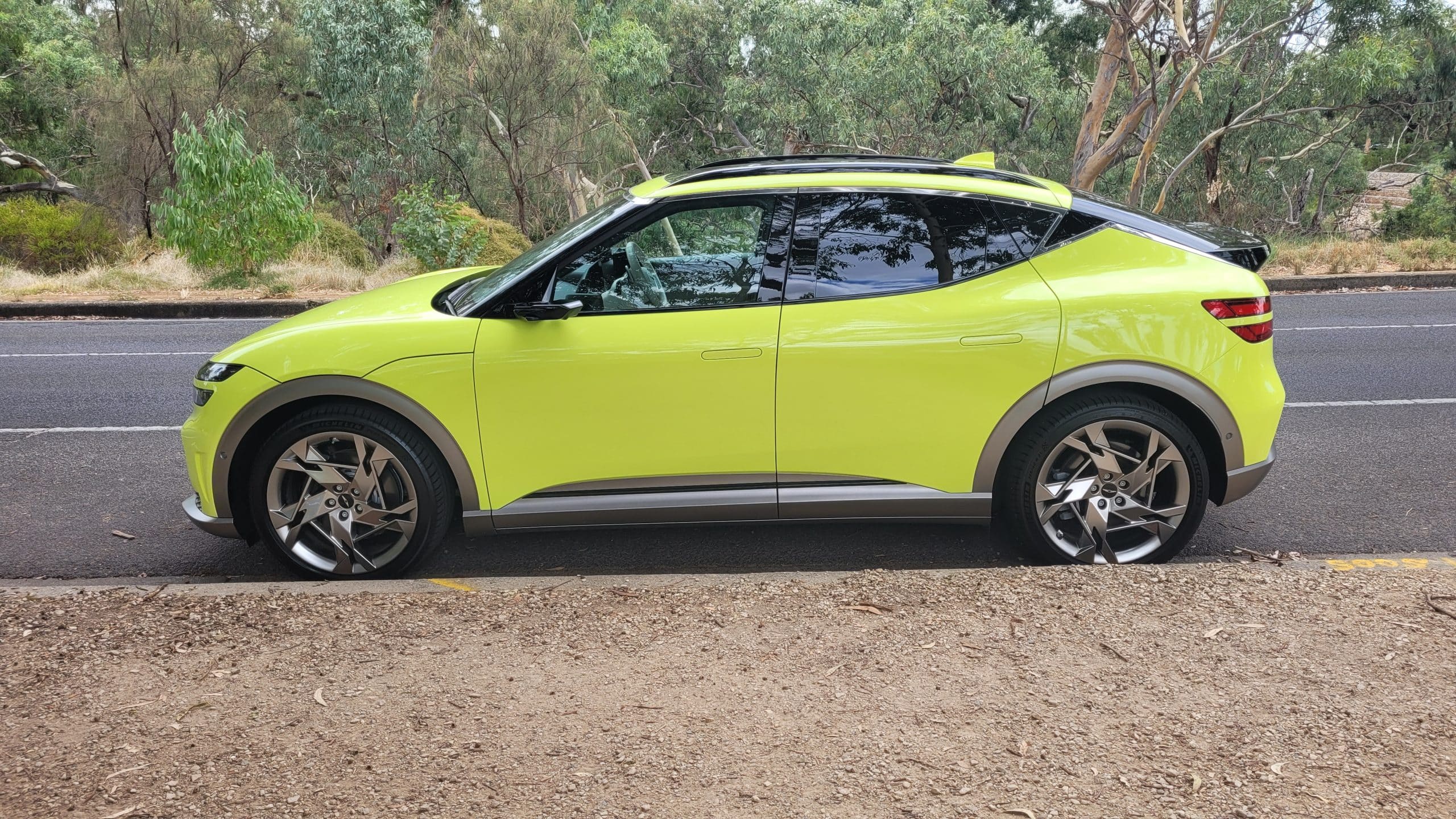 Genesis GV60 lime green profile view