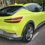 Sao Paulo Lime green Genesis GV60 rear corner view with sleek tail lights