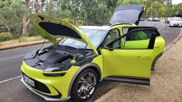 Lime green Genesis GV60 electric car Australia with bonnet, doors and rear coupe hatch door open
