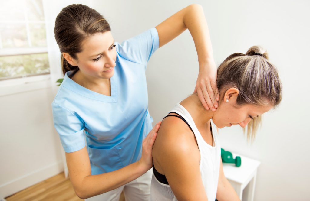Health Insurance Banner - A young woman receiving a neck and back massage from a physio