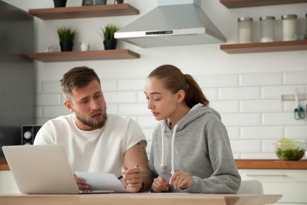 Energy Banner - Young couple looks at their gas bills before switching providers