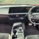 Red Kia EV6 GT-Line interior view of front dash and steering wheel