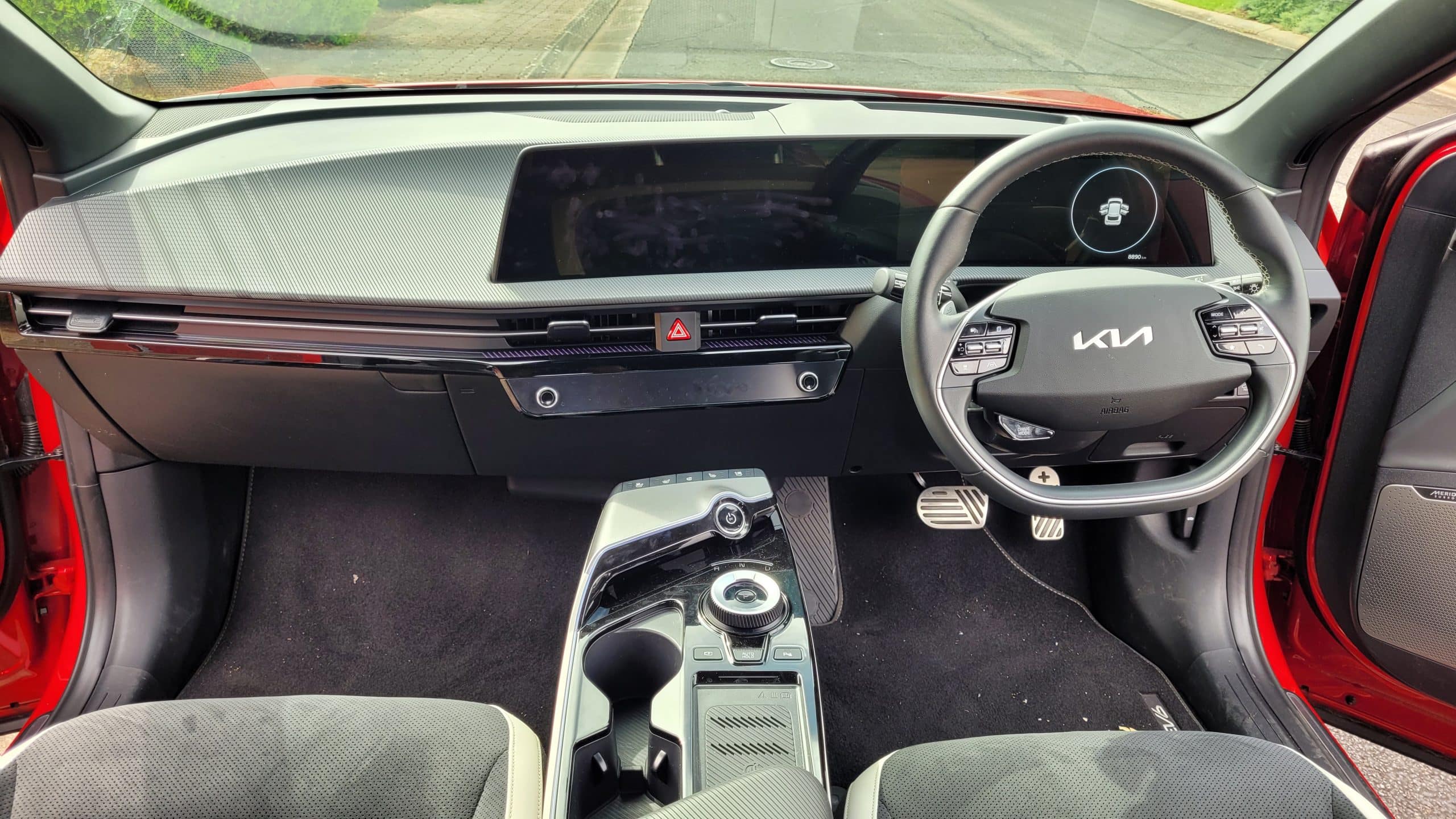 Red Kia EV6 GT-Line interior view of front dash and steering wheel