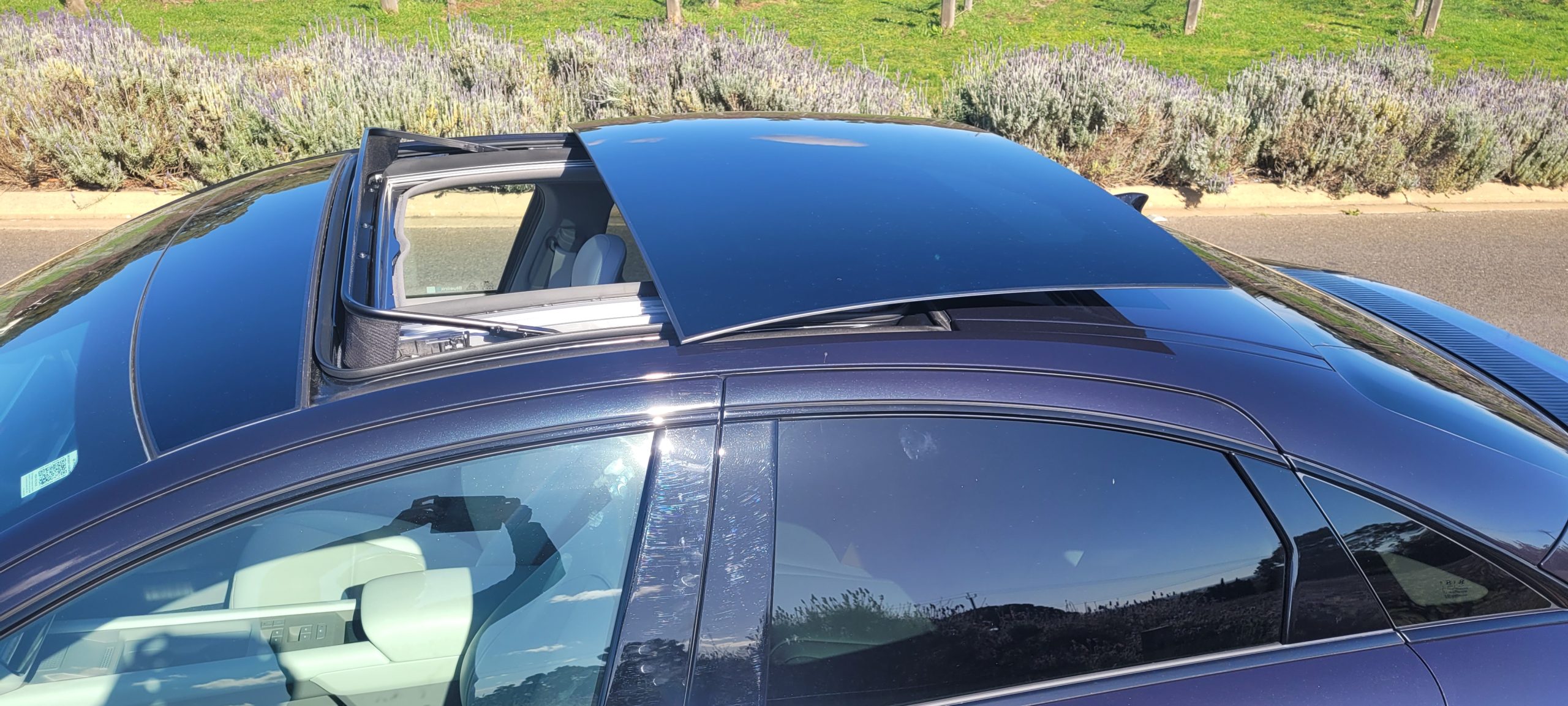 Black Hyundai IONIQ 6 TECHNIQ with open sunroof