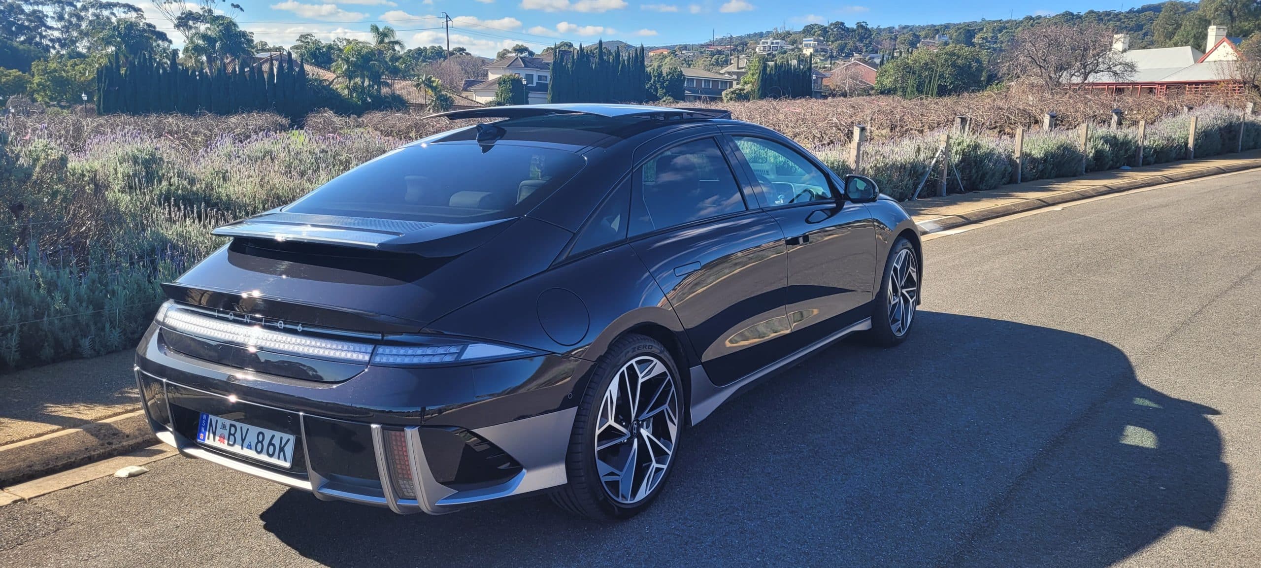 Black Hyundai IONIQ 6 TECHNIQ rear three quarter view