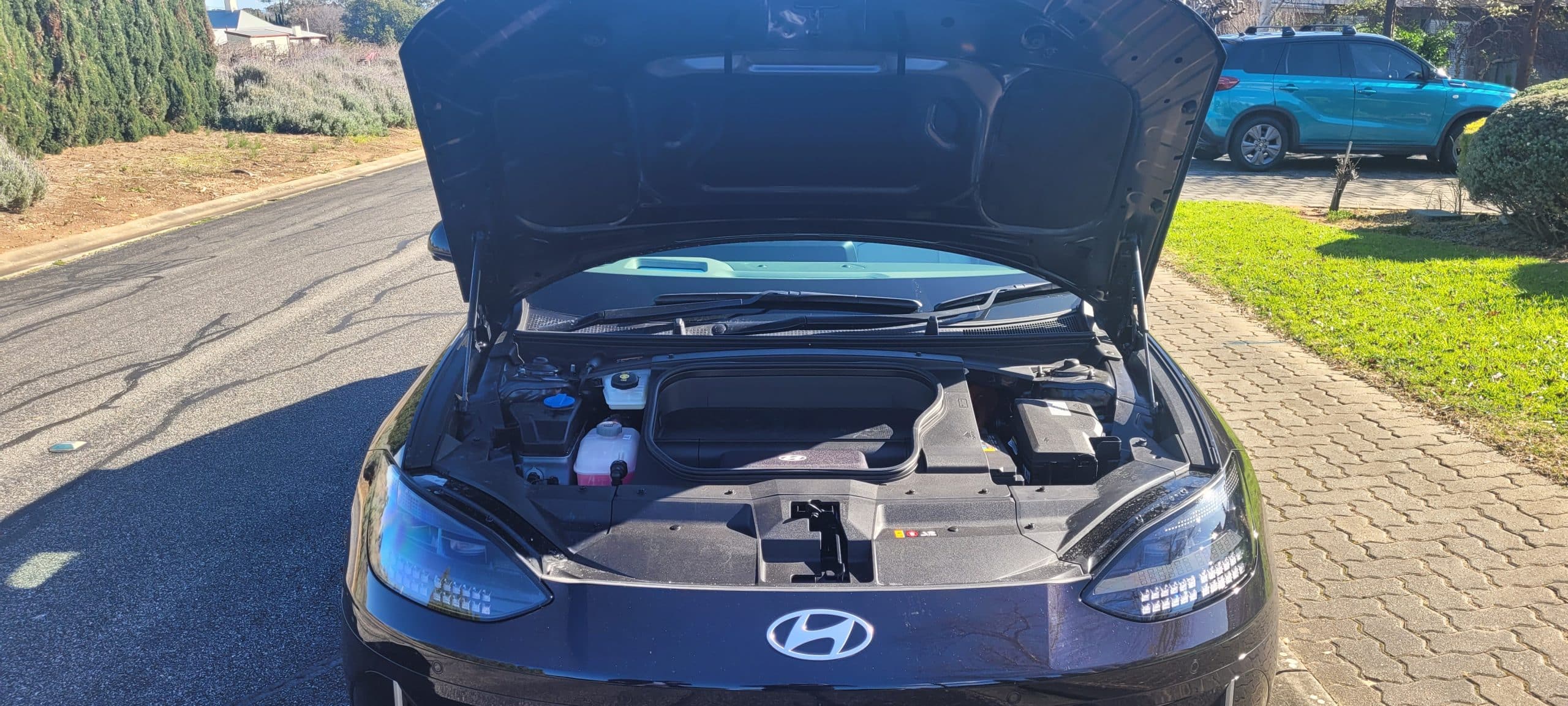 Black Hyundai IONIQ 6 TECHNIQ front hood open shoping frunk