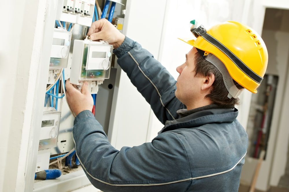 Electrician with electricity meter