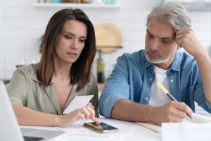 Worried couple looking at energy bill