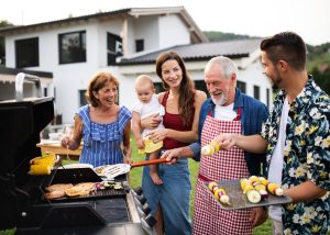 Life Insurance Banner - Senior couple having a barbeque with their children