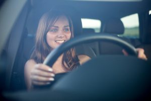 Life Insurance Banner - Young woman driving a car