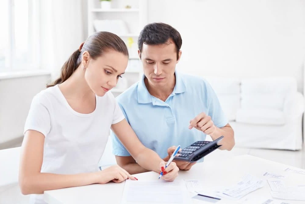 Internet Banner - Couple sitting together calculating their tax return