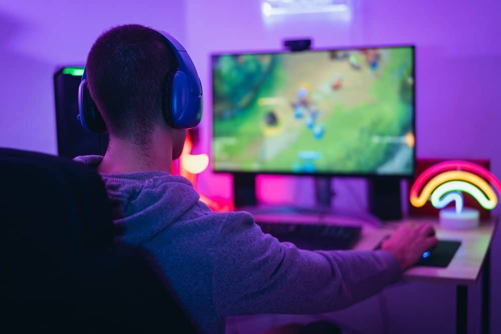 Internet Banner - Young man playing a video game on his computer