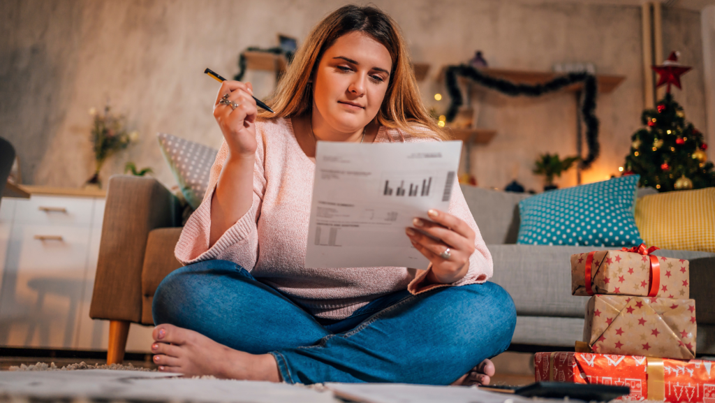 Woman looking at Christmas expenses