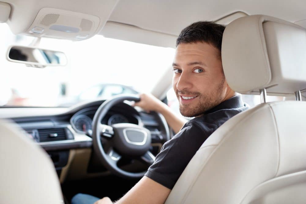 Man in driving seat of car